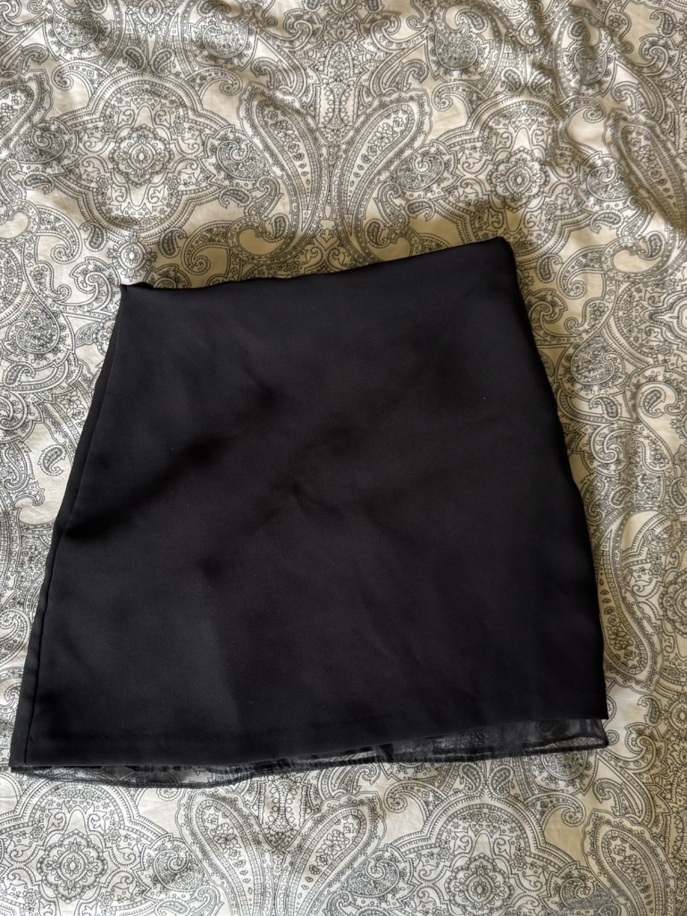 Mini black skirt with sheer lining